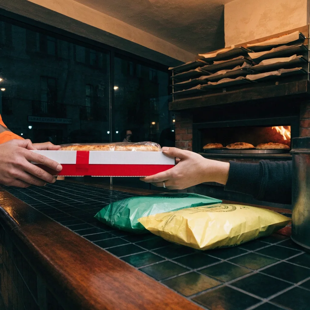 Pizza going into the stone oven at Fireaway kitchen